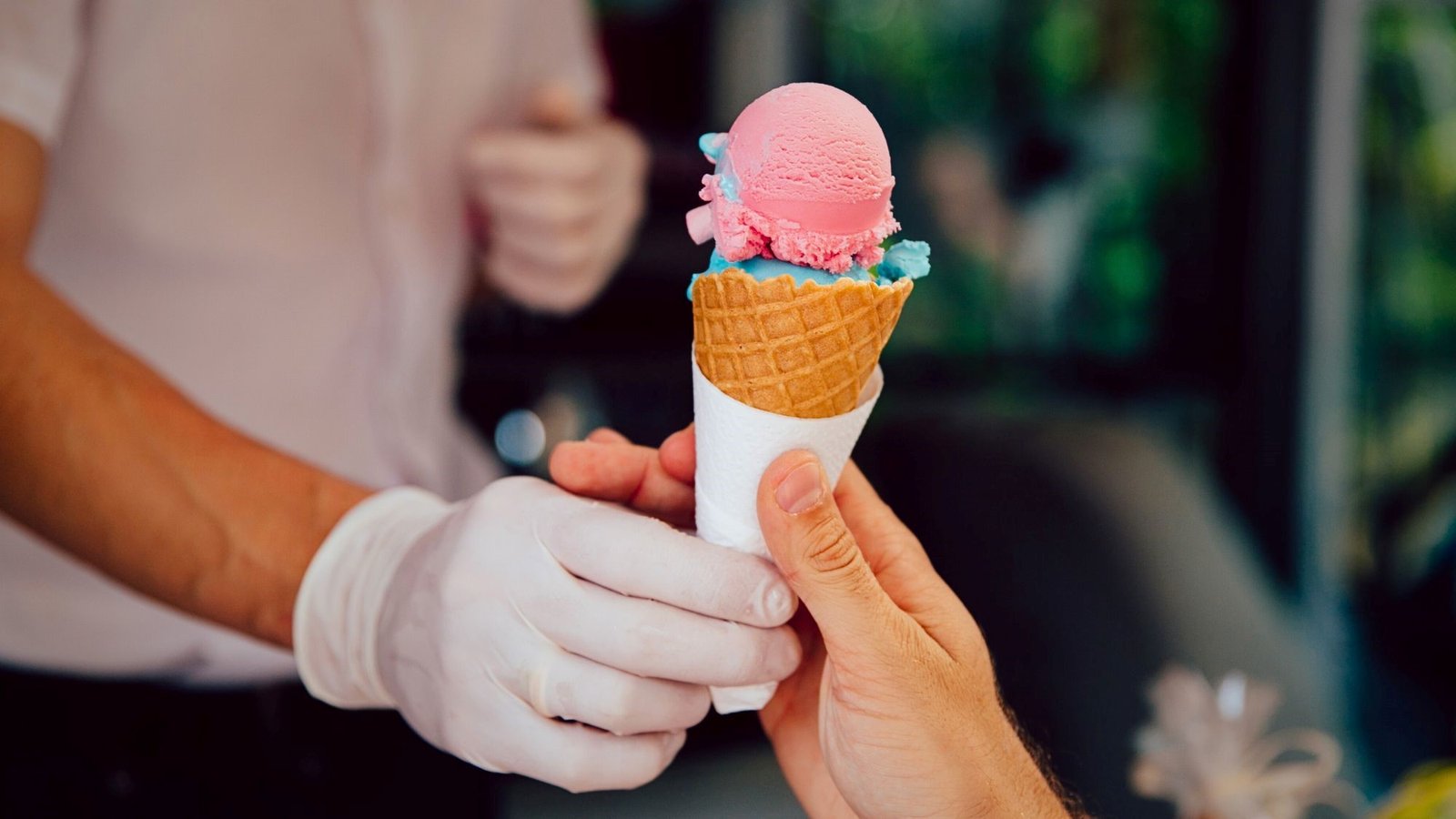 A person holding a colorful ice cream made with Taylor ice cream machine